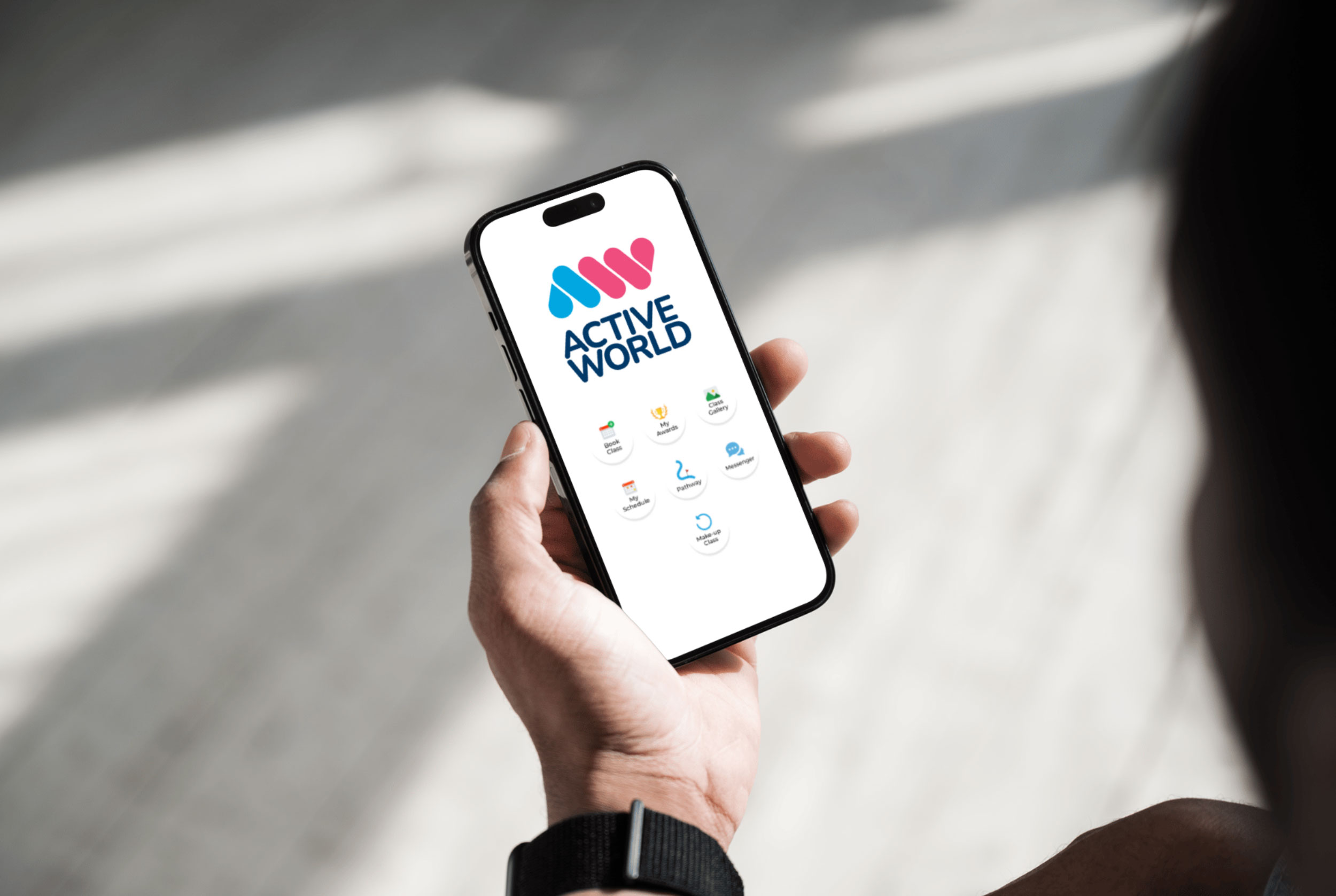 Hand holds smart phone loading Active World Member App